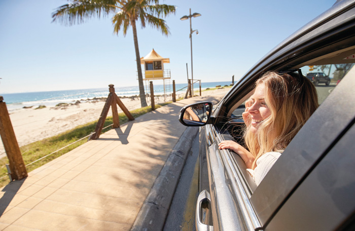 girl in car at the beach girl in car at the beach